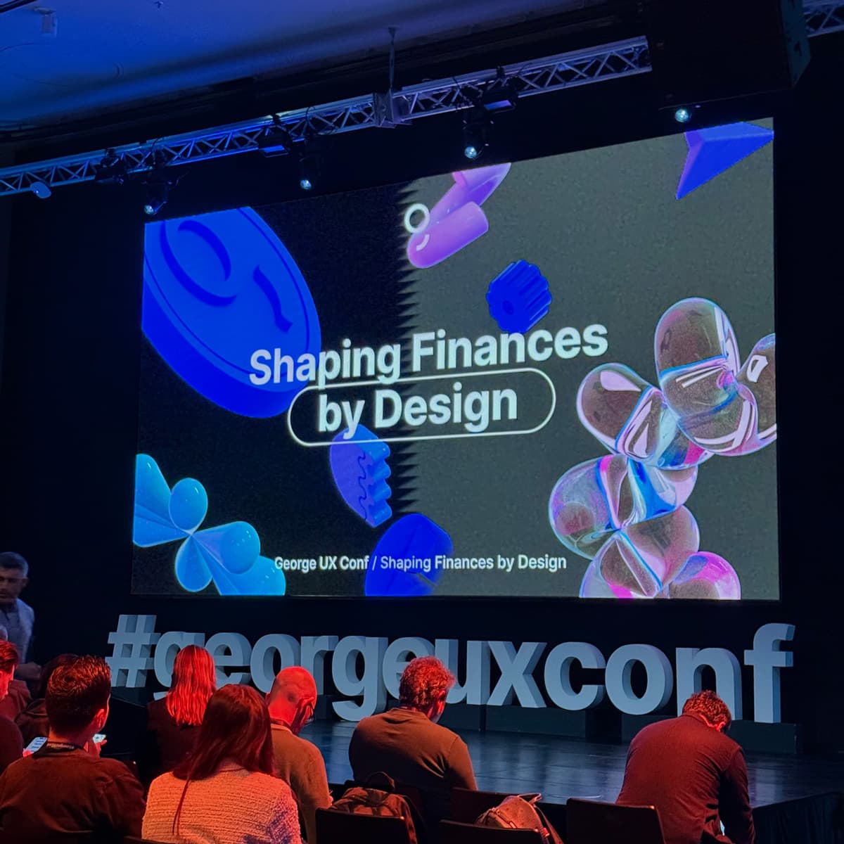 Reprezentačný slajd z konferencie s nápisom: "Shaping Finances by Design".